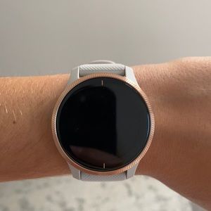 Brand new rose gold Garmin Venu smartwatch.